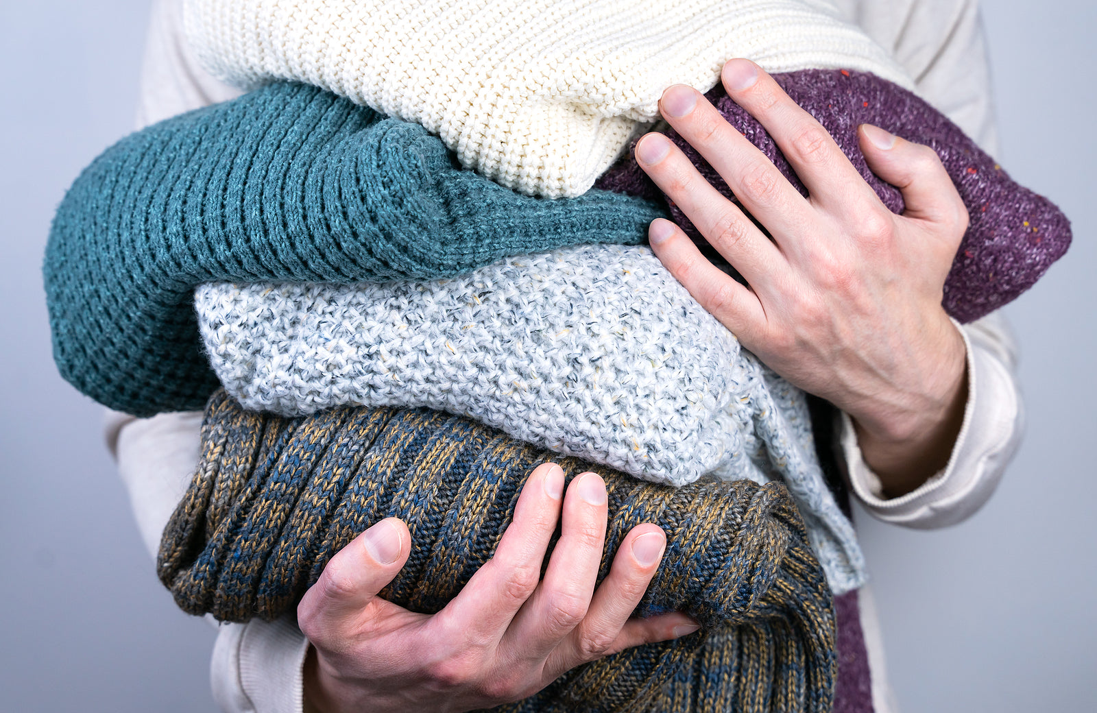 holding cashmere clothes